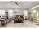 Relaxing living room with a comfortable sofa and access to backyard at 9658 E Tahoe Cir, Mesa, AZ 85212