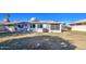 Spacious backyard with grassy area and screened patio at 9909 W Newport Dr, Sun City, AZ 85351
