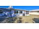 Large backyard with grassy area and screened patio at 9909 W Newport Dr, Sun City, AZ 85351