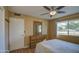 Bedroom with double bed, dresser, and ceiling fan at 9909 W Newport Dr, Sun City, AZ 85351