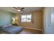 Cozy bedroom with double bed, wood floors and ample closet space at 9909 W Newport Dr, Sun City, AZ 85351