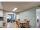 Small dining area with wooden table and four chairs at 9909 W Newport Dr, Sun City, AZ 85351
