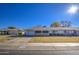 Single story home with garage and well-maintained lawn at 9909 W Newport Dr, Sun City, AZ 85351