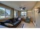 Sunroom boasts tiled floors, seating area and large windows at 9909 W Newport Dr, Sun City, AZ 85351