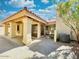 Covered patio with stucco columns and access to the backyard at 9992 E Carol Ave, Scottsdale, AZ 85258