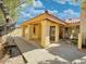 Covered patio with stucco columns and access to the backyard at 9992 E Carol Ave, Scottsdale, AZ 85258
