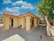 Covered patio with stucco columns, backyard access, and landscaping at 9992 E Carol Ave, Scottsdale, AZ 85258