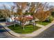 An aerial view of a charming single story home with a red tile roof and mature trees at 1001 N Burk St, Gilbert, AZ 85234