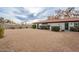 Large backyard with gravel and a home at 1001 N Burk St, Gilbert, AZ 85234