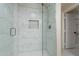 Updated bathroom with a large walk-in shower and marble tile at 1001 N Burk St, Gilbert, AZ 85234