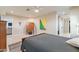 Calm bedroom with a wooden bed frame, dresser, and modern artwork at 1001 N Burk St, Gilbert, AZ 85234