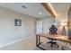 Modern home office features wood desk, red chair, and natural light at 1001 N Burk St, Gilbert, AZ 85234