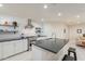 Modern kitchen with white cabinets, an island, and stainless steel appliances at 1001 N Burk St, Gilbert, AZ 85234