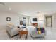 Bright living room with comfy sofas, a mid-century modern vibe, and an accent wall at 1001 N Burk St, Gilbert, AZ 85234