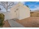 White block storage shed with a single door and walkway at 1001 N Burk St, Gilbert, AZ 85234