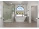 Spa-like bathroom featuring a soaking tub and a walk-in shower at 10069 E Turquoise Ave, Scottsdale, AZ 85258