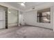 Comfortable bedroom with mirrored closet doors and neutral carpeting at 10069 E Turquoise Ave, Scottsdale, AZ 85258