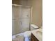 Clean bathroom with a shower/tub combo and tile flooring at 10546 W Catalina Dr, Arizona City, AZ 85123