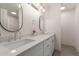 Bright bathroom with double vanity and a walk-in shower at 1164 E Westchester Dr, Tempe, AZ 85283