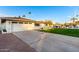 Newly remodeled home with a large grassy yard and a long driveway at 1164 E Westchester Dr, Tempe, AZ 85283