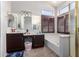 Bathroom with double sinks, soaking tub, and separate shower at 1269 N Layman St, Gilbert, AZ 85233