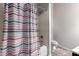 Bathroom with shower/tub combo and striped shower curtain at 1269 N Layman St, Gilbert, AZ 85233