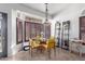 Bright breakfast nook with a glass table and yellow chairs at 1269 N Layman St, Gilbert, AZ 85233