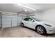 Garage with white Tesla Model Y at 1269 N Layman St, Gilbert, AZ 85233