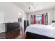 Bright main bedroom with dark wood floors and a ceiling fan at 1269 N Layman St, Gilbert, AZ 85233