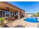 Inviting kidney-shaped pool with covered patio and seating at 1269 N Layman St, Gilbert, AZ 85233