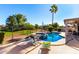 Large backyard pool with patio and lounge chairs at 1269 N Layman St, Gilbert, AZ 85233