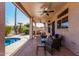 Covered patio with pool, lounge furniture, and dining area at 1269 N Layman St, Gilbert, AZ 85233