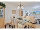 Spacious dining area with glass table, view into living room at 13635 N 111Th Ave, Sun City, AZ 85351