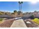 Front view of a light beige building with a walkway and landscaping at 13635 N 111Th Ave, Sun City, AZ 85351