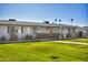 Exterior of a light beige building with lawn and walkway at 13635 N 111Th Ave, Sun City, AZ 85351