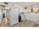 Bright kitchen with white cabinets, stainless steel appliances, and wood floors at 13635 N 111Th Ave, Sun City, AZ 85351