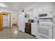 Bright kitchen with white appliances and ample counter space at 13635 N 111Th Ave, Sun City, AZ 85351