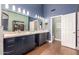 Modern bathroom with dual vanity and walk-in shower at 14215 W Mountain Laurel Trl, Surprise, AZ 85374