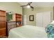 Bedroom with built-in shelving and closet at 14215 W Mountain Laurel Trl, Surprise, AZ 85374