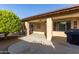 Covered patio with seating area and built-in grill at 14215 W Mountain Laurel Trl, Surprise, AZ 85374