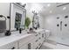 Modern bathroom with double vanity, soaking tub, and walk-in shower at 14241 N 54Th St, Scottsdale, AZ 85254