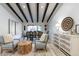 Bright dining area with wood table and chairs, and adjacent kitchen at 14241 N 54Th St, Scottsdale, AZ 85254