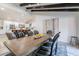 Elegant dining room features a long wooden table and modern kitchen access at 14241 N 54Th St, Scottsdale, AZ 85254