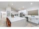 Modern kitchen with a large island, white cabinetry, and stainless steel appliances at 14241 N 54Th St, Scottsdale, AZ 85254