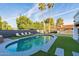 Inviting kidney-shaped pool with lounge chairs and lush landscaping at 14241 N 54Th St, Scottsdale, AZ 85254