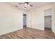 Well-lit bedroom with wood-look floors and ample closet space at 14352 W Lamoille Dr, Surprise, AZ 85374