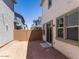 View of the backyard featuring the sliding glass door and surrounding homes at 14644 W Sand Hills Rd, Surprise, AZ 85387
