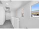 Upstairs hallway with natural lighting streaming in from several windows at 14644 W Sand Hills Rd, Surprise, AZ 85387