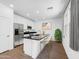 Bright kitchen with stainless steel appliances, black granite countertop, and breakfast bar seating at 14644 W Sand Hills Rd, Surprise, AZ 85387