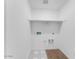 New laundry room, boasting ample shelving and clean, modern design at 14644 W Sand Hills Rd, Surprise, AZ 85387